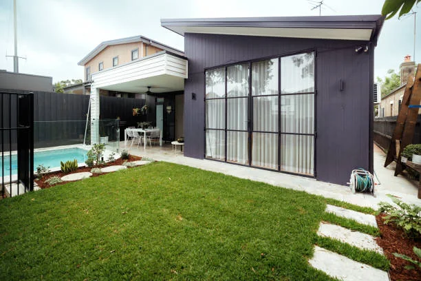 Contemporary home opening onto a calm green garden