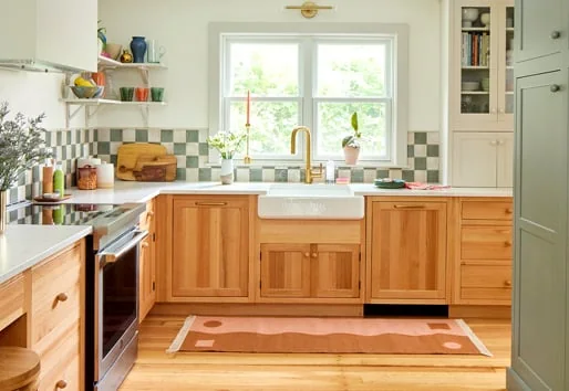 Warm, inviting kitchen with timber details and a bright window